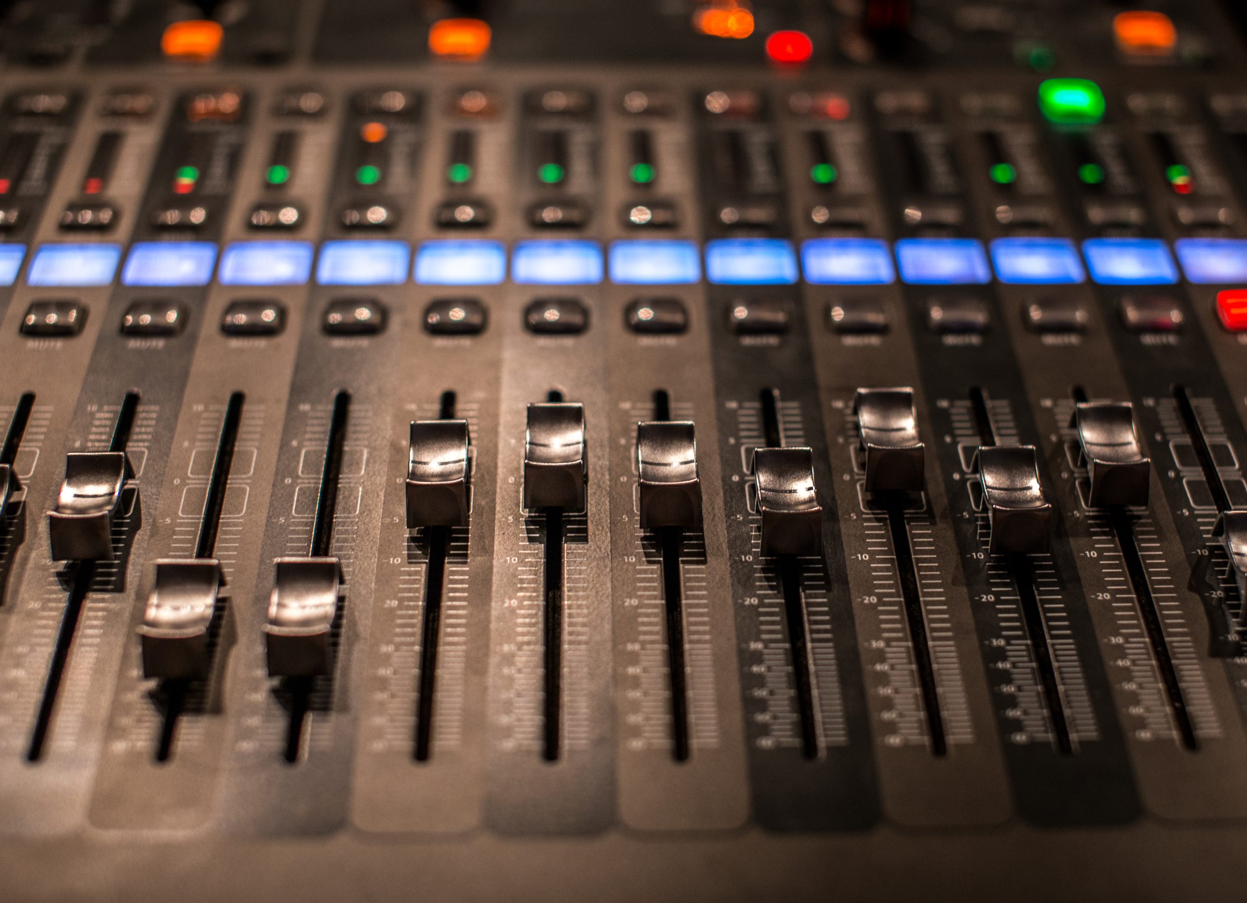 fader digital mixing console with volume meter, volume indicator, closeup